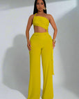 Woman wearing a yellow outfit with a white background