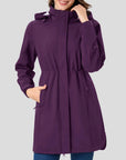 Purple coat worn by a person on a gray background