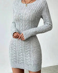 Gray knitted dress worn by a person on a plain background